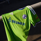 FC Schalke 04 2026/27 green Third Jersey crest, sponsor and fabric detail