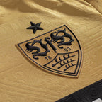 VfB Stuttgart 2026/27 gold Third Jersey crest and fabric detail